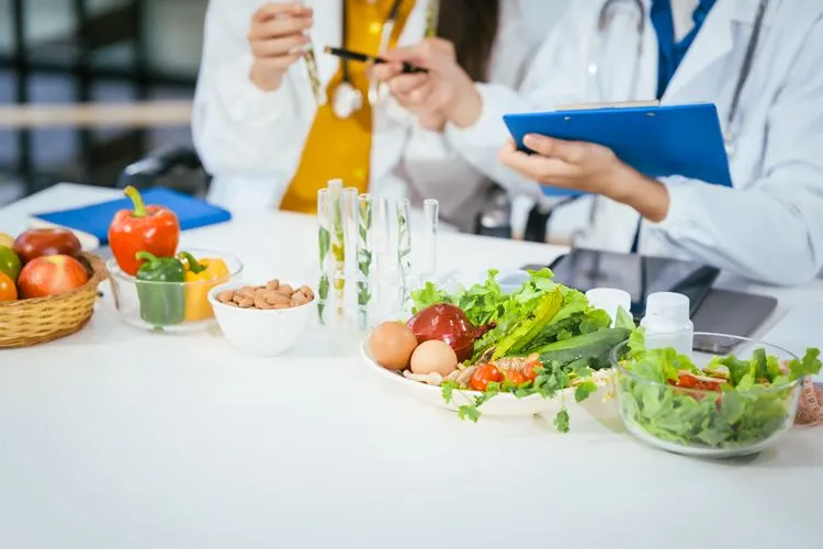 Two nutritionists reviewing supplement research — Metagenics Akkermansia is the most evidence-backed pasteurised option available to Irish buyers